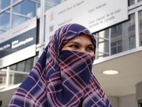 Zunera Ishaq talks to reporters outside the Federal Court of Appeal after her case was heard on whether she can wear a niqab while taking her citizenship oath, in Ottawa on Tuesday, September 15, 2015.