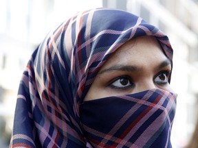 Zunera Ishaq talks to reporters outside the Federal Court of Appeal after her case was heard on whether she can wear a niqab while taking her citizenship oath, in Ottawa on Tuesday, September 15, 2015.