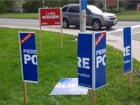 Vandalized Pierre Poilievre signs in Stittsville. The Conservative candidate's campaign manager says 'hundreds and hundreds' of signs have been vandalized or stolen.