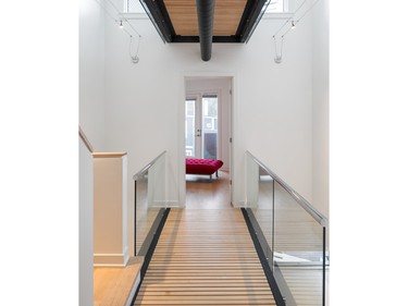 RND Construction and Hamel Design Inc. won in the category of housing details for suspended bridges that hover over the second and third floors of a semi-detached home to separate private spaces from public areas.