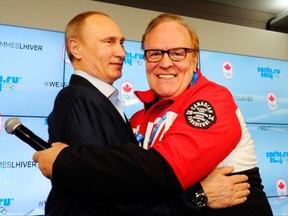 Then-Canadian Olympic Committee president Marcel Aubut (right) works his charm on Russian President Vladimir Putin when the latter visited Canada House during the Sochi Winter Olympics in February 2014 in Sochi, Russia.