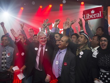 Supporters of Justin Trudeau, leader of the Liberal Party of Canada, not pictured, celebrate as results come in on election night in Montreal, Quebec, Canada, on Monday, Oct. 19, 2015. Trudeau's Liberal Party has swept into office with a comfortable majority, tapping into voter fatigue with Prime Minister Stephen Harper by pledging more spending to stimulate Canada's sluggish economy. Photographer: Kevin Van Paassen/Bloomerg