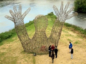 Marc Walter uses natural materials like wood, rock and earth in his Land Art sculptures. His eight-metre tall L’Embrassade (The Hug) creation, a three-week project in France, contains a red heart.