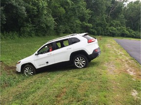 A driver attempts to reverse a Jeep Cherokee after its brakes were remotely disabled and sent the SUV into a ditch during a demonstration for Wired magazine.