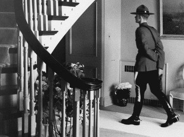 A Mountie walks through the prime minister's residence, 24, Sussex Dr., in May 1961.