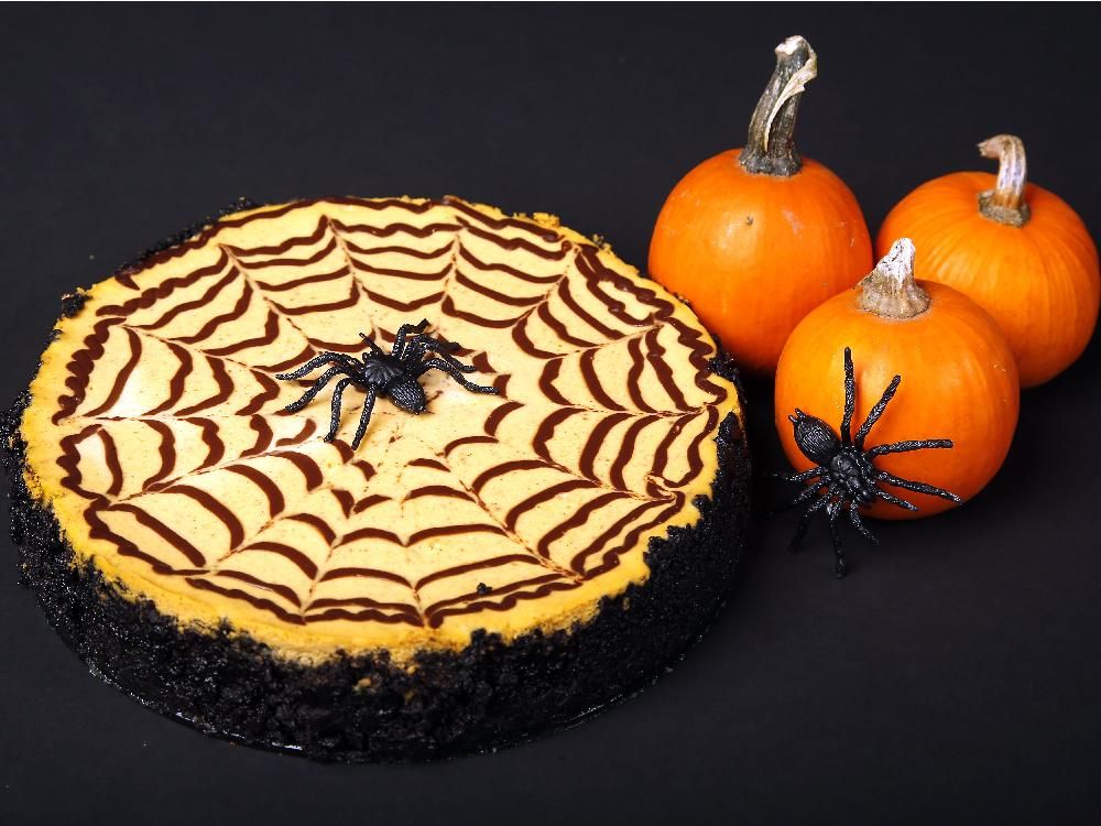 Pumpkin cheesecake with chocolate spiderweb Halloween treat. Ottawa