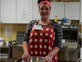 Adrianna Sorgo, part of the Solutions for Youth program, makes some granola in the kitchen.
