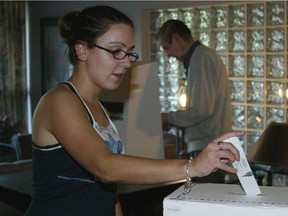 A young voter casts her ballot in 2004. By 2013, the turnout for youth voters was below 40 per cent.