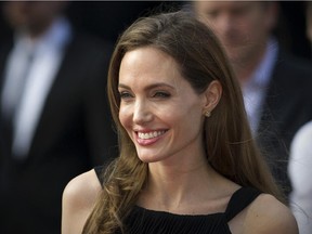 (FILES) In this file picture taken on June 2, 2013 US actress and humanitarian campaigner Angelina Jolie poses as she arrives for the British premiere of her US actor and fiance Brad Pitt's latest film "World War Z" in Leicester Square in central London.  Angelina Jolie announced on March 24, 2015 that she has had her ovaries and fallopian tubes removed over fears of cancer, following her double mastectomy two years ago. The actress, who has lost her mother, grandmother and aunt to cancer, made the announcement in an op-ed piece in the New York Times.