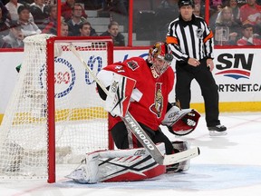 OTTAWA, ON - OCTOBER 28:  Craig Anderson #41 of the Ottawa Senators watches the puck after making a save  during an NHL game against the Calgary Flames at Canadian Tire Centre on October 28, 2015 in Ottawa, Ontario, Canada.