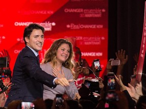 Canadian Liberal Party leader Justin Trudeau and his wife Sophie greet supporters in Montreal on October 20, 2015 after winning the general elections.