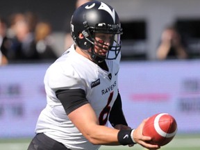 Carleton Ravens quarterback Jesse MIlls was able to take a seat after his team stormed to a 40-0 lead by halftime.
