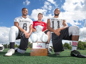 Carleton University football players Dexter Brown, (L), Jesse Mills, (C) and Nate Behar, (R), were involved in the Hail Mary pass that led to a last-play touchdown and victory against U of O in the 2014 Panda Game.