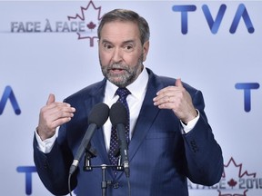 NDP Leader Tom Mulcair speaks to members of the media after taking part in a French-language debate in Montreal on Friday, Oct. 2, 2015.