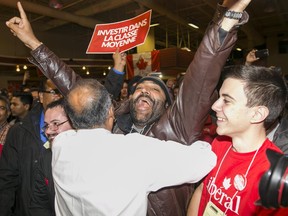 Chandra Arya embraces supporters at his campaign office after officially winning his riding of Nepean.