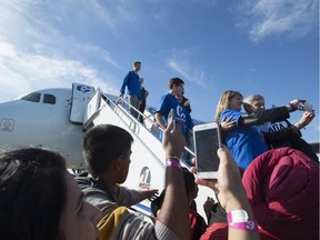 Conservative Leader Stephen Harper takes a selfie with a supporter on the steps of his campaign plane during a quick stop in Regina on Sunday.