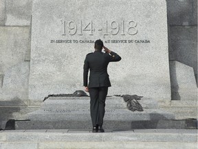 A member of the Canadian Forces salutes as he passes in front of the Tomb of the Unknown Soldier at the National War Memorial in Ottawa, Wednesday Oct. 21, 2015. A ceremony will be held Thursday to mark the one year anniversary of a shooting at the memorial which killed Cpl. Nathan Cirillo.