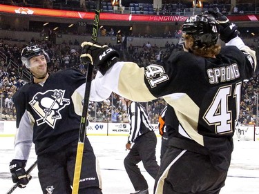 Pittsburgh Penguins' Daniel Sprong (41) celebrates his first NHL goal with teammate Matt Cullen (7) during the second period.
