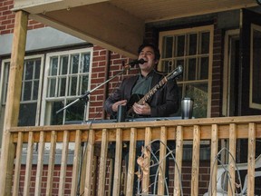 David Ranger playing guitar at 130 Holland Ave. as part of Porchfest in Hintonburg, Saturday