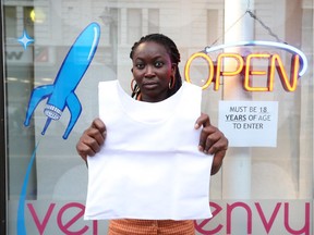 Deborah, who is a sales associated at Venus Envy store is  photographed with a "binder".  A Bank Street sex shop has been slapped with a $260 fine under a city bylaw after a teen purchased a "chest binder" -- a sleeveless elastic undervest used to flatten the chest.