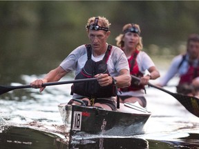 Dr. Christoph Weber, foreground, and Bonnie Pankiw used their efficient paddling technique to win the second annual K2O (Kingston to Ottawa) canoe marathon through the Rideau Canal lock system in under 24 hours.