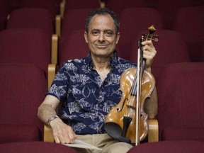 Eugene Drucker is seen here in the the Music Hall in Raanana, Israel. In 1933, because of a decision by a Nazi offocial, his father, the violinist Ernest Drucker, was not able to play the full Brahms concerto in Cologne.