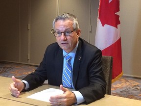 International Trade Minister Ed Fast speaks to reporters in Atlanta, Wednesday, Sept.30, 2015.