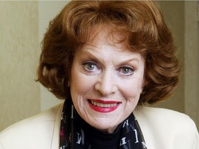 In this March 9, 2004 file photo, actress Maureen O'Hara poses for a photo in the Bel Air Estates area of Los Angeles.  Her manager says O'Hara died in her sleep Saturday, Oct. 24, 2015 at her home in Boise, Idaho.
