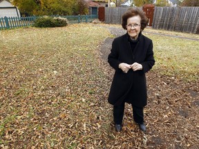 Fleur-Ange Cormier in the backyard of her home. After neighbours complained about the length of the grass the city sent a contractor to cut her grass who charged her nearly $500.