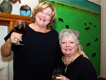 From left, Carol Laureys with Linda Murphy, seated, at a reception held Wednesday, October 28, 2015, at the private home of Barbara McInnes for The Match International Women's Fund and its patron, Shirley Greenberg.
