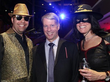 From left, entrepreneurial networker Jarrod Goldsmith with Ottawa-Orleans Liberal MP-elect Andrew Leslie and veterinarian Dr. Ariane Finsten (dressed in honour of her dog Zora) at the Halloween-themed ARTinis benefit soirée for the AOE Arts Council, held at the Shenkman Arts  Centre on Thursday, October 29, 2015.
