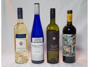 (From left) Nobilo Sauvignon Blanc, Washington Hills Riesling, Farnese Fantini, and Porta 6 for wine column by Rod Phillips. Assignment - 121666 Photo taken at 08:32 on September 21. (Wayne Cuddington/ Ottawa Citizen)