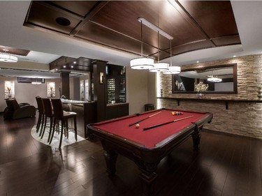Just Basements won in the category of basement renovation, $75,000 and over for a sophisticated basement design with barrel-vaulted ceilings, cherry wood and stone to create both a family destination and a great place to entertain larger gatherings.