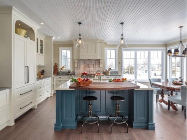 Astro Design Centre won custom kitchen, 241 sq. ft. or more, traditional, $75,000 and over for an elegant country-style kitchen by Nathan Kyle. Drawing inspiration from the nearby Rideau River, an oversized island in blue adds a pop of colour.