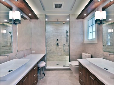 Gordon Weima Design Builder won in the category of custom bathroom, 100 sq. ft. or less, for a revamped ensuite that stole space from an unused bedroom to create more elbow room, then divided his and hers vanities and anchored it all with the shower at the end.
