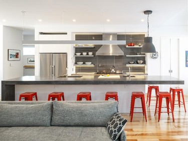 Linebox Studio and The Lake Partnership Inc. won in the category of custom kitchen, 241 sq. ft. or more, contemporary, $74,999 and under, for a sleek linear kitchen that adds pops of red to a neutral base of grey and white.