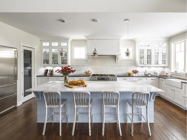 Astro Design Centre won in the category of custom kitchen, 241 sq. ft. or more, traditional, $74,999 and under, for an 'effortlessly elegant' kitchen that highlights 'an impressive slab of Bianco Carrera marble' on the island.