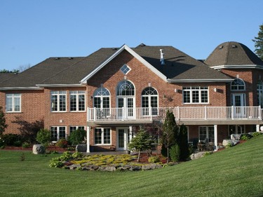 An expansive home on a quiet cul-de-sac near the Rideau River, this architecturally stunning home is filled with an array of antiques collected by the homeowners on their travels. The artfully landscaped property reflects their love of gardening, while a large deck is the perfect spot to relax with friends and listen to water falling into the pond. Tour decorators: Mill Street Florists.