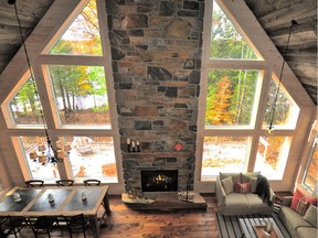 A 30-foot stone fireplace and chimney becomes an obvious focal point in this Muskoka cottage by StyleHaus Interiors. Combined with 150-year-old reclaimed barn board on the ceiling and other reclaimed wood touches throughout, the three-bedroom home has an "authentic Canadiana cottage" feel. The project was a finalist in the category of anywhere in the world.