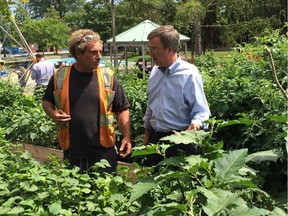 Residents who use the community gardens at McNabb Park showed off their crops to Mayor Jim Watson this summer.