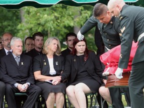 OTT-0714(2007)-(OTTAWA)-FUNERAL-Beechwood Military Cemetery--dad James Anderson; mom Sheila Anderson; wife Amanda Anderson--funeral service for Corporal Jordan J. Anderson--for NATIONAL story. OTTAWA CITIZEN PHOTO by PAT MCGRATH (CANWEST NEWS SERVICES) --THE OTTAWA CITIZEN. ASSIGNMENT NUMBER 85142