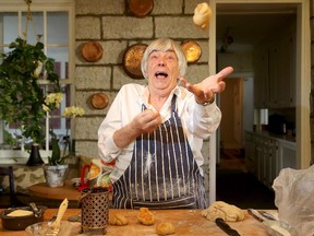 Gay Cook attempts to juggle some dinner rolls fresh out of the oven at her historic Ottawa home. Algonquin College is holding a fundraiser for the the local cook and food writer — who turns 85 this year — for a new bakery at the college, to be named after her. (Julie Oliver / Ottawa Citizen)