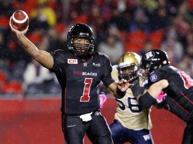 Henry Burris of the Ottawa Redblacks throws against the Winnipeg Blue Bombers during first half CFL action.