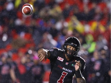Henry Burris of the Ottawa Redblacks throws against the Winnipeg Blue Bombers during first half CFL action.
