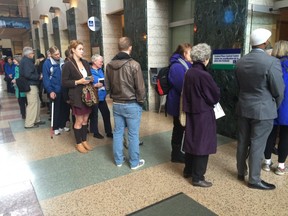 Voters queue up at City Hall to cast ballots in the Ottawa Centre advance poll.