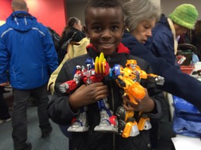 Jabari Khaemba, 8, scored two Transformers robots for $1 each at the OC Transpo unclaimed items sale.