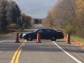 Ontario Provincial Police have closed two rural roads in North Grenville after a body was found on Wednesday night.