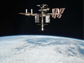 This May 23, 2011 file photo released by NASA shows the International Space Station at an altitude of approximately 220 miles above the Earth, taken by Expedition 27 crew member Paolo Nespoli from the Soyuz TMA-20 following its undocking.