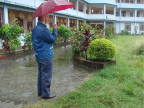 Jurme Wangda stands in front of the Kalimpong Seniors Home built by Ottawa Friends of Tibet.
