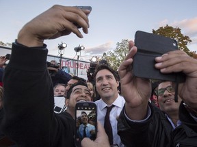 Liberal leader Justin Trudeau stops for a photo during a rally Wednesday, October 14, 2015 in Ajax, Ont.